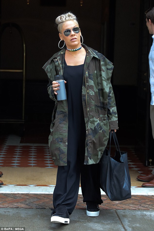 No pink: On Thursday the star was spotted leaving her hotel solo, in an all-black outfit under a long camouflage coat